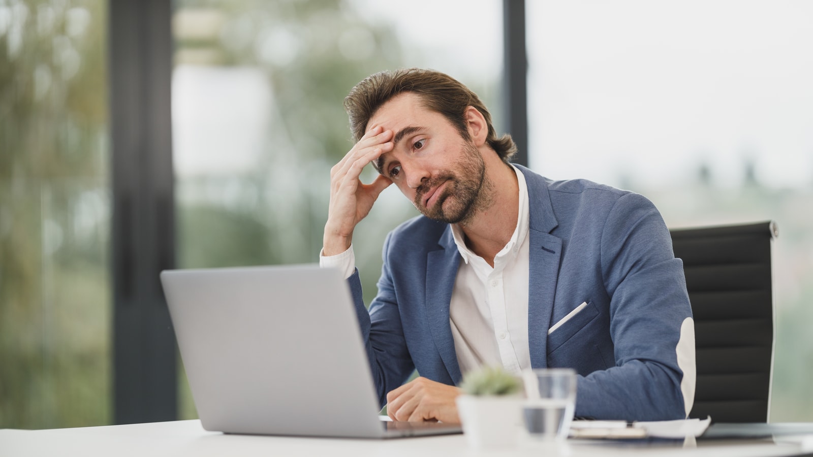 Business tax paperwork and calculator on an office desk