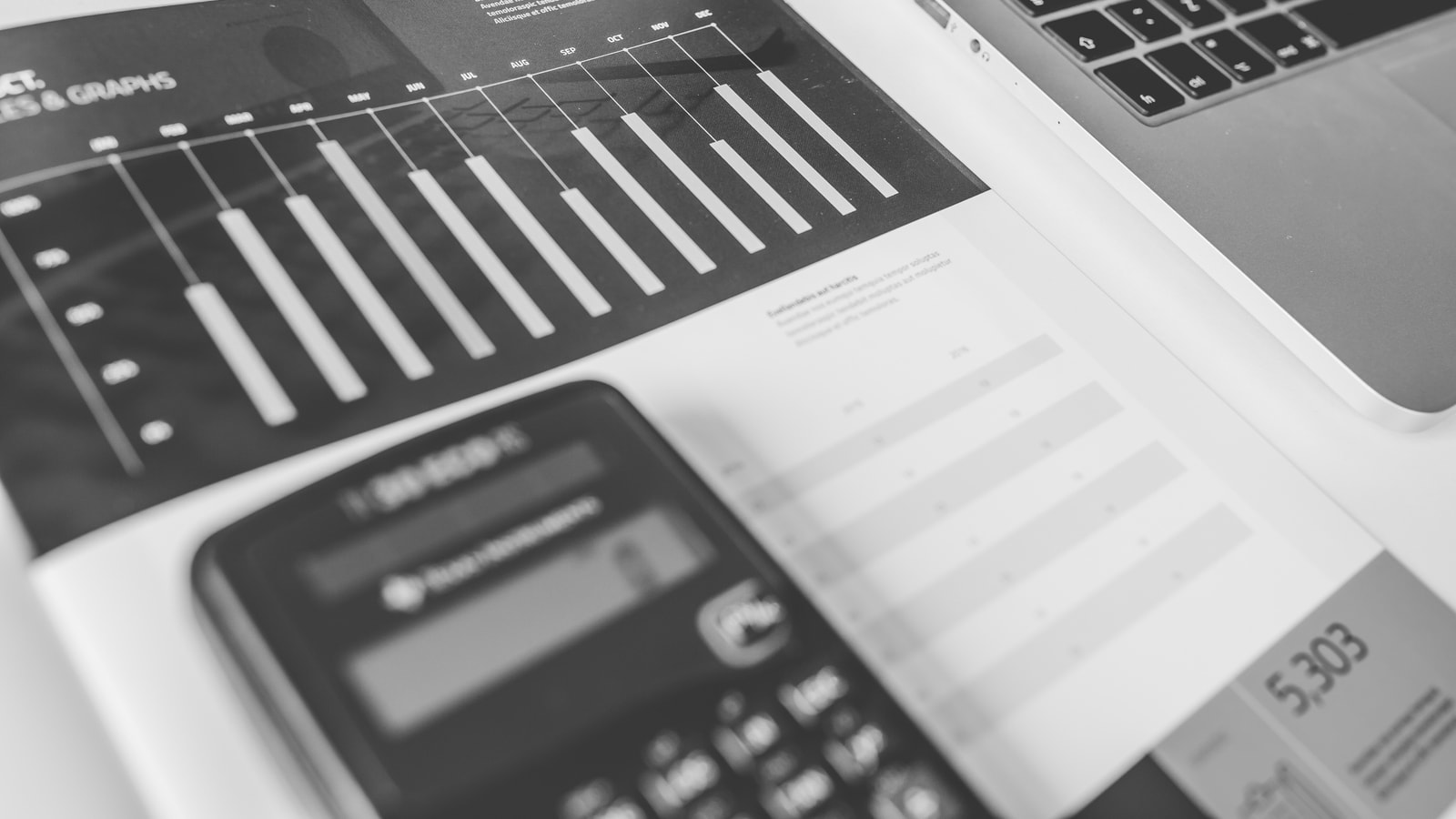 Business tax paperwork and calculator on an office desk
