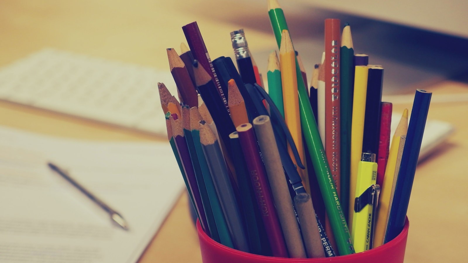 Business tax paperwork and calculator on an office desk