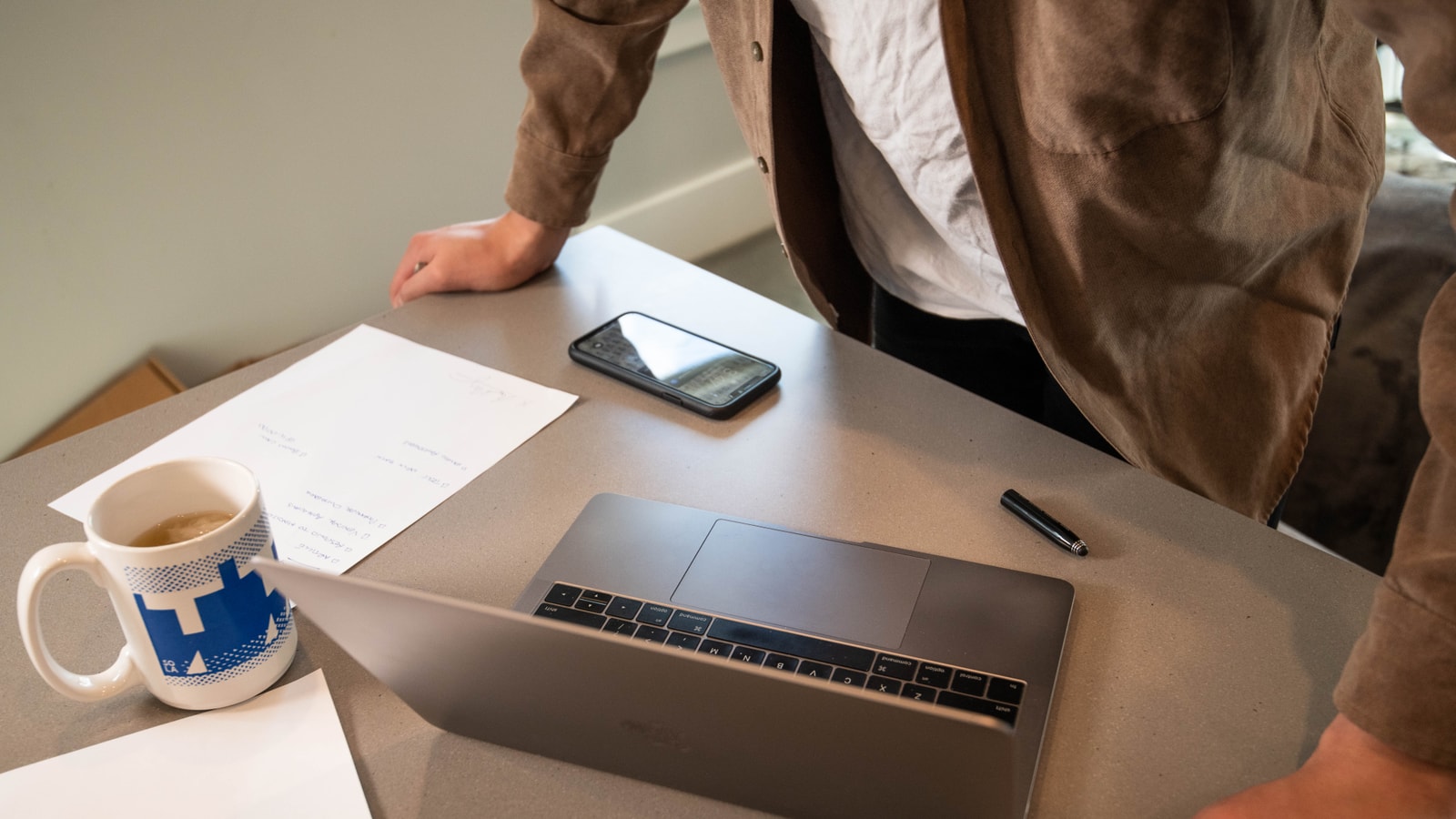 Business tax paperwork and calculator on an office desk