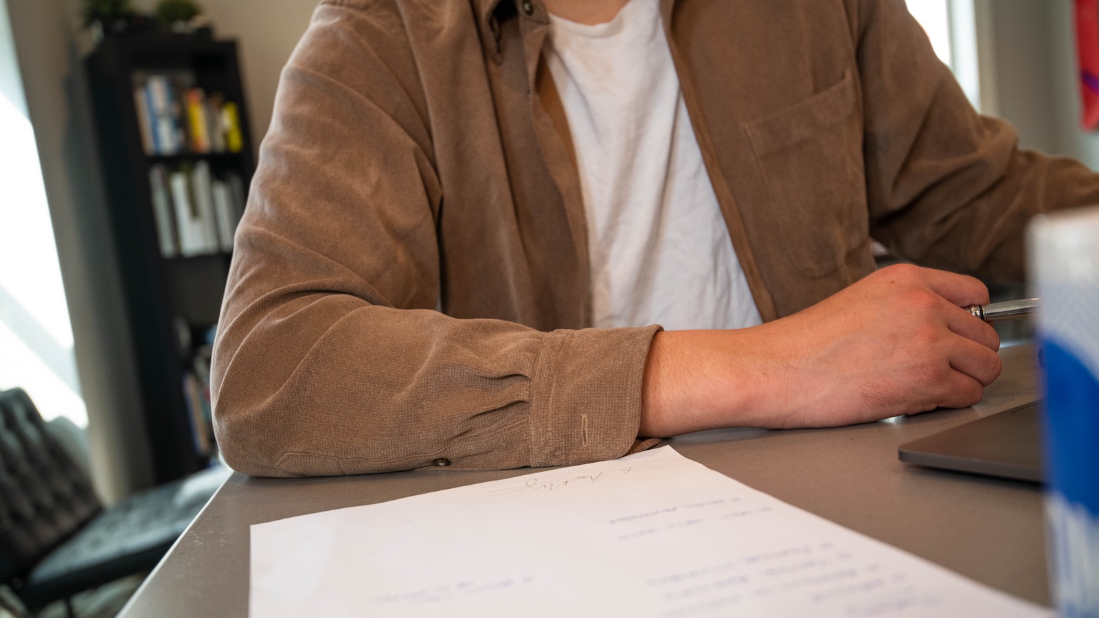 Business tax paperwork and calculator on an office desk