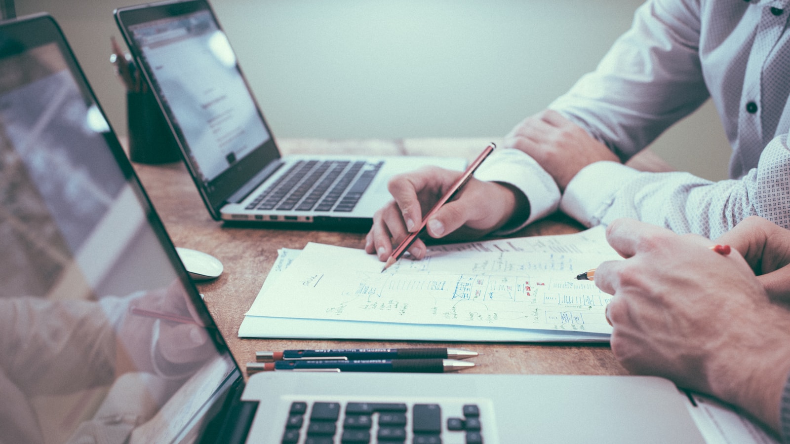 Business audit and compliance documents prepared for a review meeting