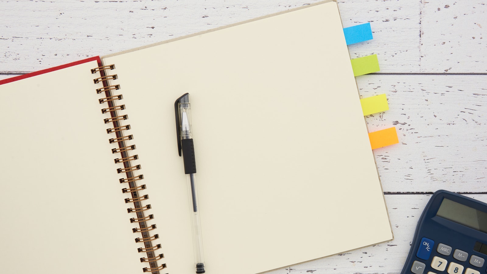 Business tax paperwork and calculator on an office desk