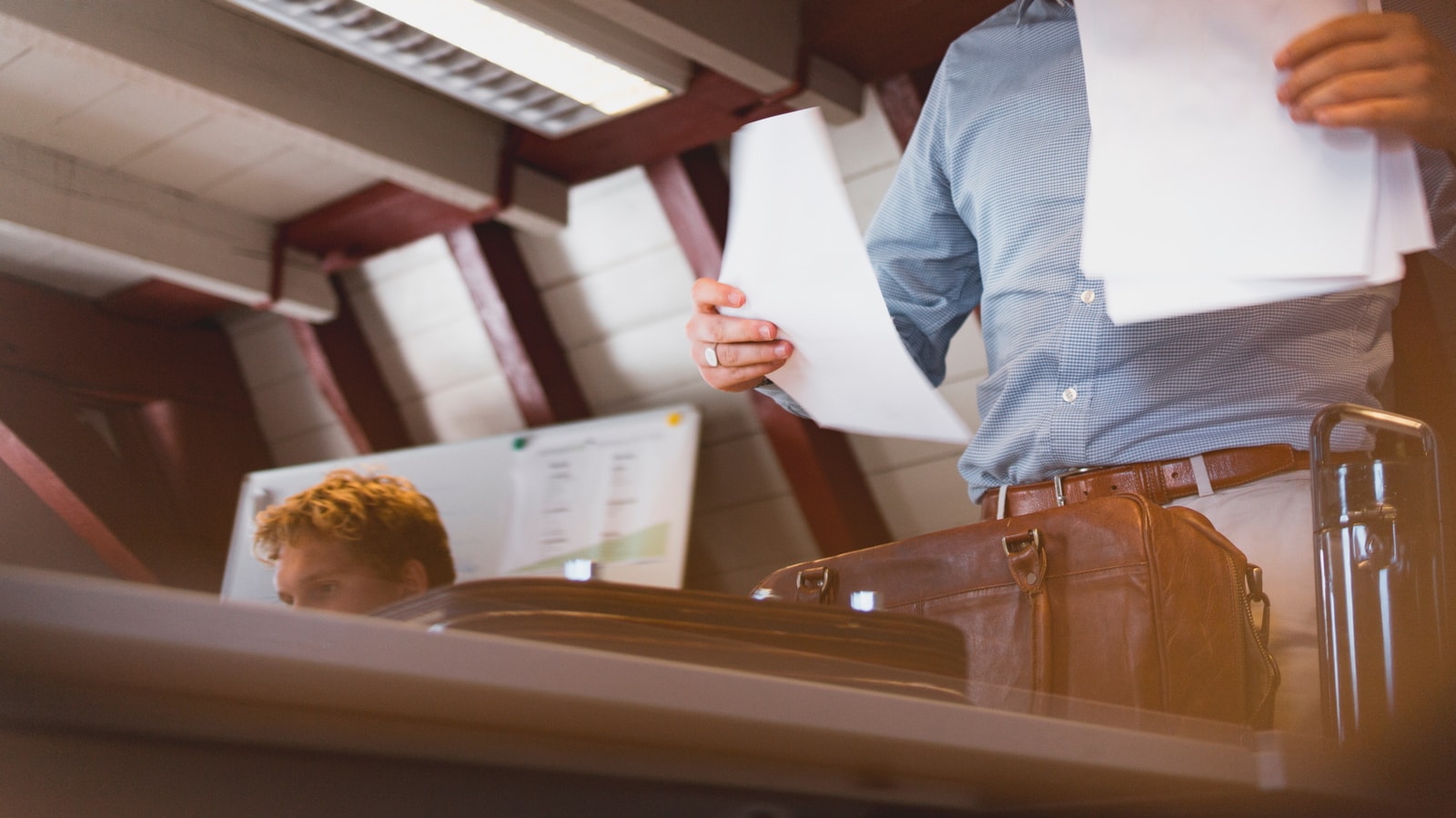 Business tax paperwork and calculator on an office desk