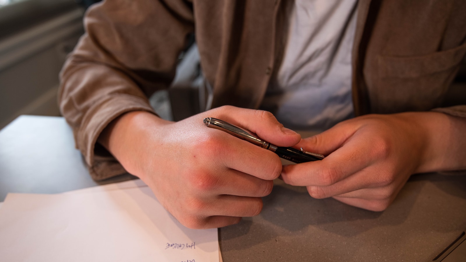 Business tax paperwork and calculator on an office desk