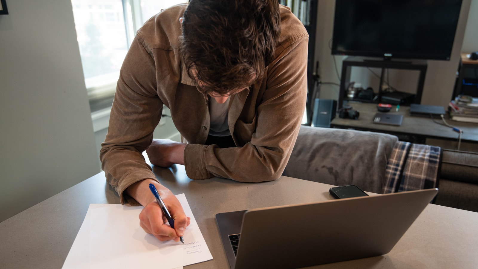 Business tax paperwork and calculator on an office desk